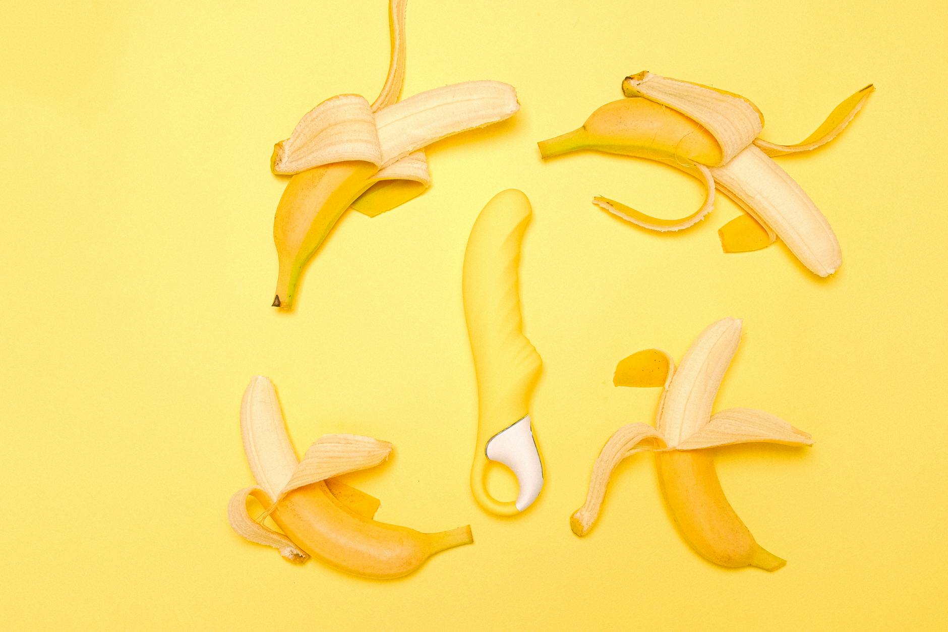 Yellow silicone lemon vibrator on bright background symbolizing pleasure and connection